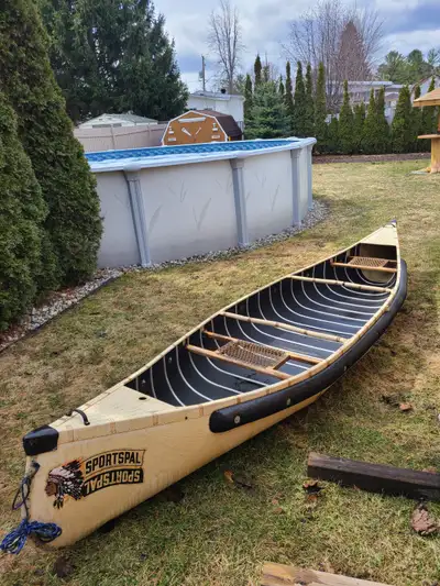 14 foot Sportspal canoe - mesh seats, 2 paddles. Good condition, well maintained, 1 owner