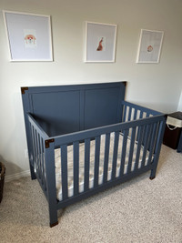 Navy blue adjustable height crib