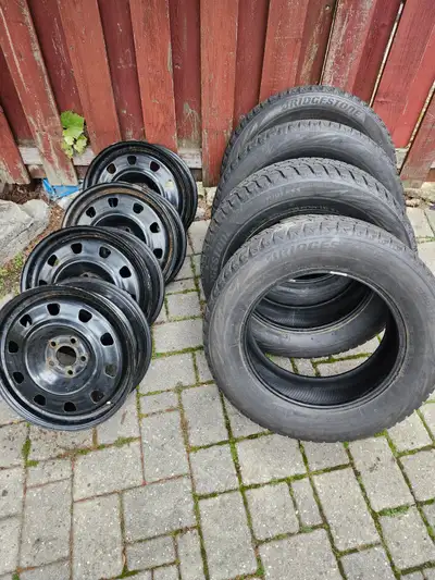 4 - 17"x 6.5" - 5 bolt 110mm spacing Includes 4 - 255/65R17 Blizzak WS80 (2017) winter tires (good f...