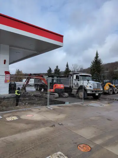 Excavating company with multiple excavators bulldozer skid steers trucks, pony trailers and float pl...