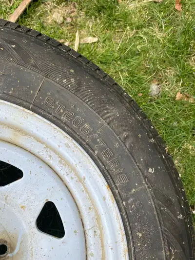 3 trailer tires and rims Hardly used Lots of life left and no holes or plugs