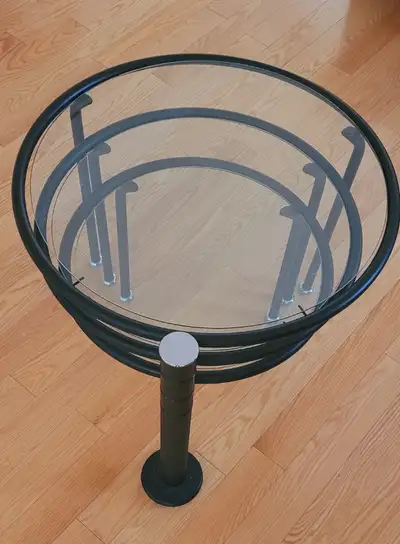 3 Tiered Expandable Round Glass Table With Black Metal Poles., View more