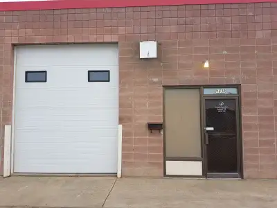 Commercial shop with a mezzanine for storage. Has 3-phase power, exhaust fan, 10ft. x 12ft steel ins...