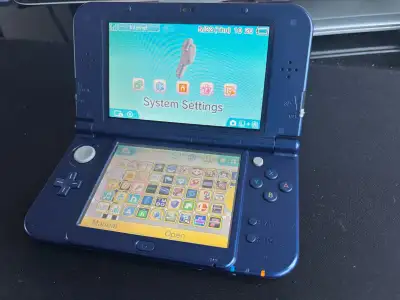 Selling a used metallic blue Nintendo New 3DS XL Console (Japanese version LL), perfect for gaming o...