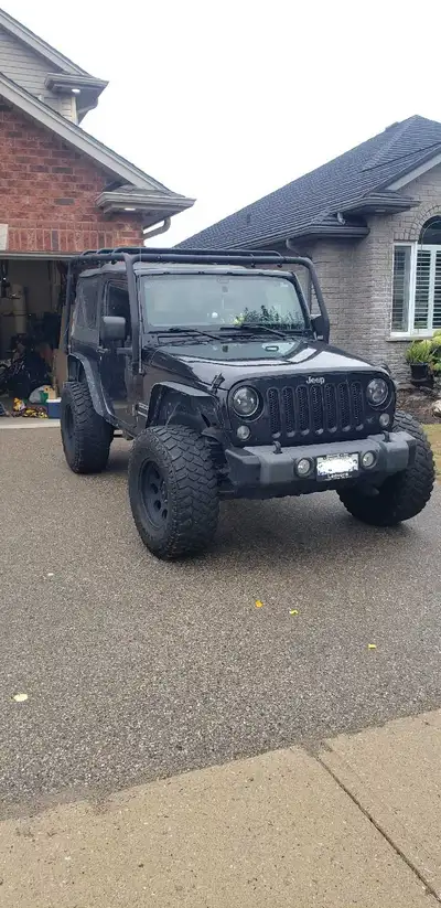 2018 Wrangler Sport JK with 139,000km it is an automatic, runs beautifully its my daily driver to wo...