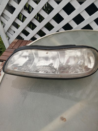 Left headlight 2002 Chevy Malibu
