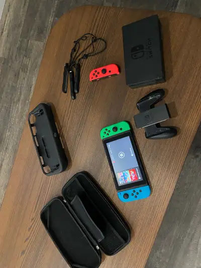 Experience versatile gaming with this pre-owned Nintendo Switch console, which features a hybrid des...