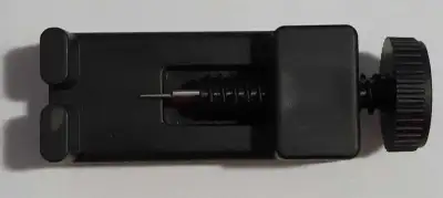 This is a used small wristwatch chain de-link tool designed to easily adjust the length of metal wat...
