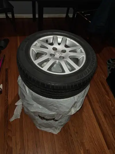 Selling a Honda wheel with a Bridgestone Potenza tire. The tire size is 195/60R15. The wheel size ap...