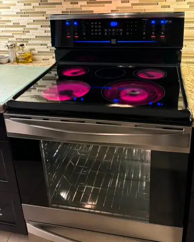 Kenmore Elite 30” Electric Glass Top Range. Glass touch control panel includes 5 burners (3 in 1 lar...