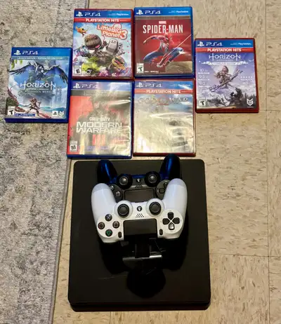 PS4 Slim with controllers and games, View more