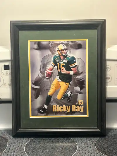 This is a framed picture of CFL Edmonton Elks Ricky Ray. It would be perfect for any football fan's...
