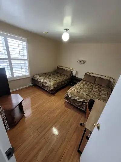 Bright room with 2 beds and a private bathroom with shower. Shared kitchen and laundry room availabl...