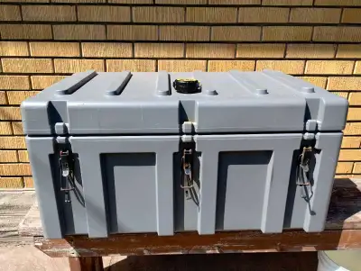 This is a heavy-duty grey toolbox, perfect for storing and transporting your tools. It shows some si...