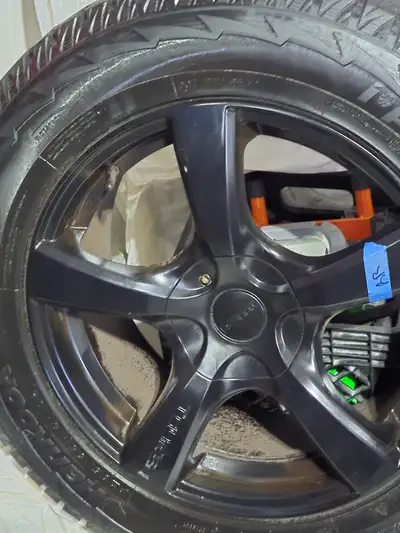 Selling a set of winter tires mounted on rims. Size: P235/65R18 104T Condition: Good tread, no damag...