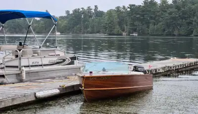 1959 16 foot Peterborough Cedar strip boat with 1959 35 Hp Johnson Motor. Boat was stored in a garag...