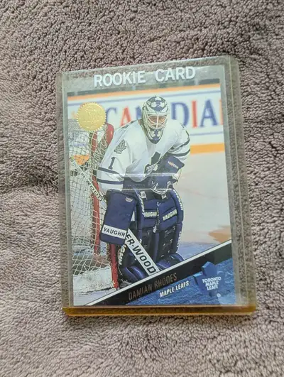 Add this classic Damian Rhodes Toronto Maple Leafs rookie card to your hockey collection today. This...