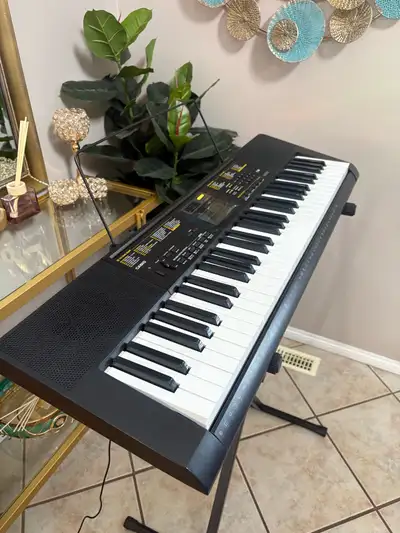 Piano keyboard in excellent condition & accessories , View more
