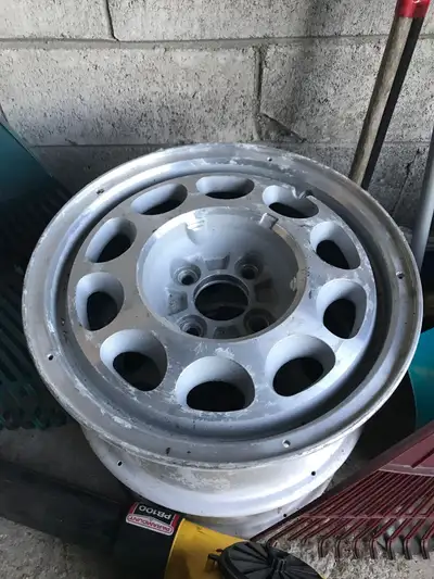 2 Used Rims from an 86 Mustang . Rims are not warped, they have been drilled but will still work.