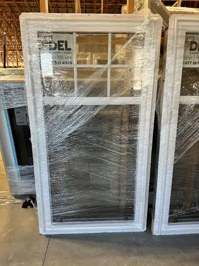 Two available Custom split single hung 31 7/8" x 61" Grill pattern in top sash 6 5/8" jamb Brickmoul...