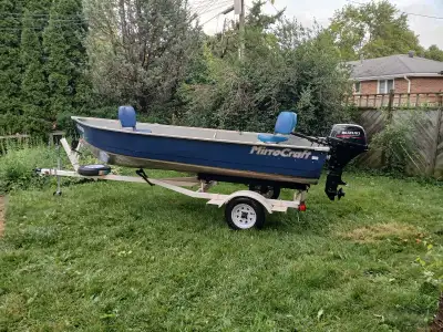 14 ft Mirrocraft aluminum fishing boat. Good solid deep wide body boat. Fuel injected 15hp Suzuki 4...