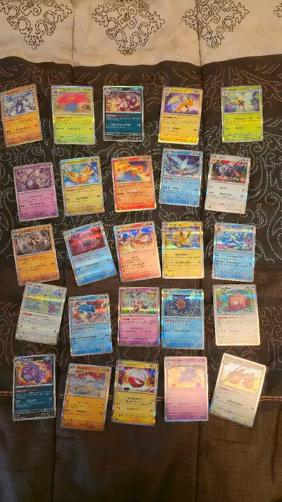 Comes with all the base cards and the regular holographic cards. No master ball or reverse holos