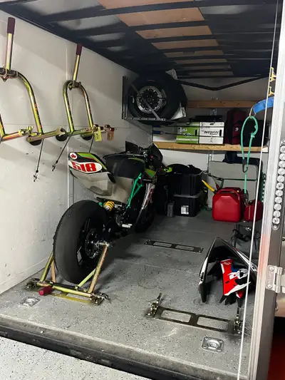 6x12 enclosed trailer used for motorcycle transport. Has 3 pit bull brackets mounted, foldable tire...