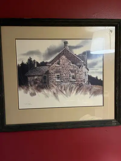 This is a Jack Reid signed print, capturing the rustic charm of a stone house nestled amidst a tranq...