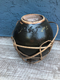 Antique Chinese terracotta urn with lid.