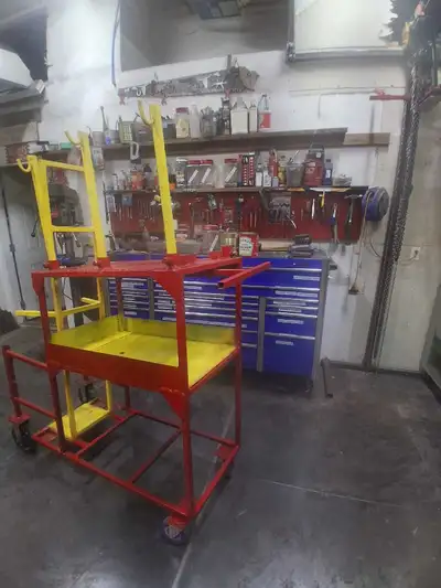Heavy duty welding cart with a storage rack underneath we had to make it high so we could weld the I...