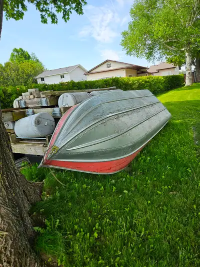 14' aluminum fishing boat as is. Needs transom. Hasn't been in water for 4 years