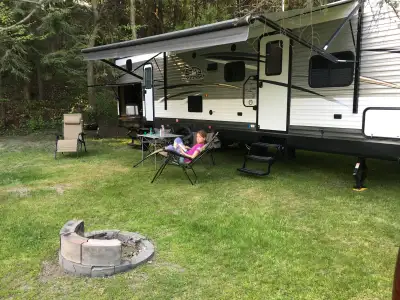 This spacious 35.5-foot travel trailer sleeps up to 10 and includes: - Private Queen Bedroom with a...