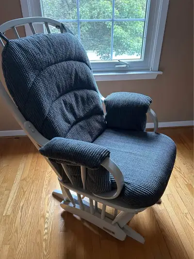 This is a classic and comfortable gliding rocking chair with a smooth motion, perfect for a nursery...