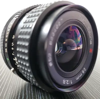 Up for sale is a classic RMC Tokina 28mm f/2.8 manual focus prime lens. This is a compact, well-buil...