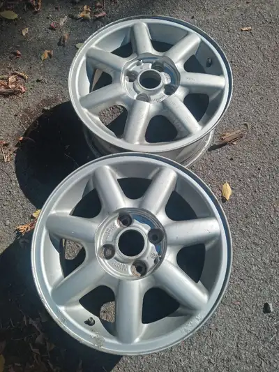 Pair of silver painted aluminum wheels off a 1990s VW. 14 inch wheels, 6 inches wide. Bolt pattern i...