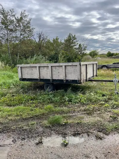 8x10 skidoo trailer with built up sides. It does tilt also. 2” ball, have 2 4x8 sheets of treated pl...