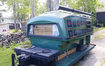 I have an older 8' Space Kap converted to a camper. It is on a trailer which is included. Unit has 5...