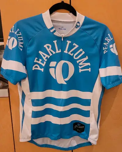 Great condition. Turquoise & white biking jersey for road or MTB. Half zip front short-sleeved jerse...