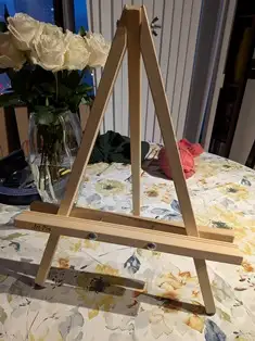 Natural finish 24" hardwood display easel with rubber tipped feet offers sturdy support ledge with a...
