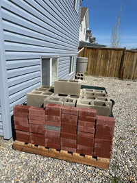 Miscellaneous cinder blocks and red bricks 