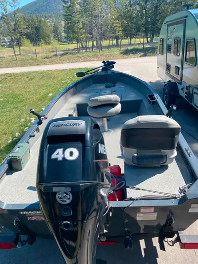 Great fishing boat! Barely used. 40HP Mercury 4-Stroke Tiller • 16’ aluminum hull • Minn Kota PowerD...