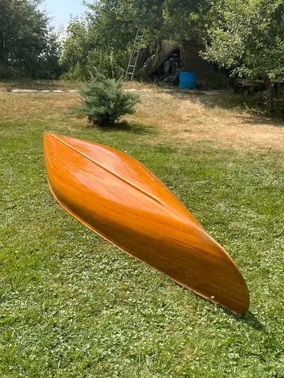 Selling my 15 ft antique cedar strip canoe. (34" wide) It's in good condition and is stable and ligh...
