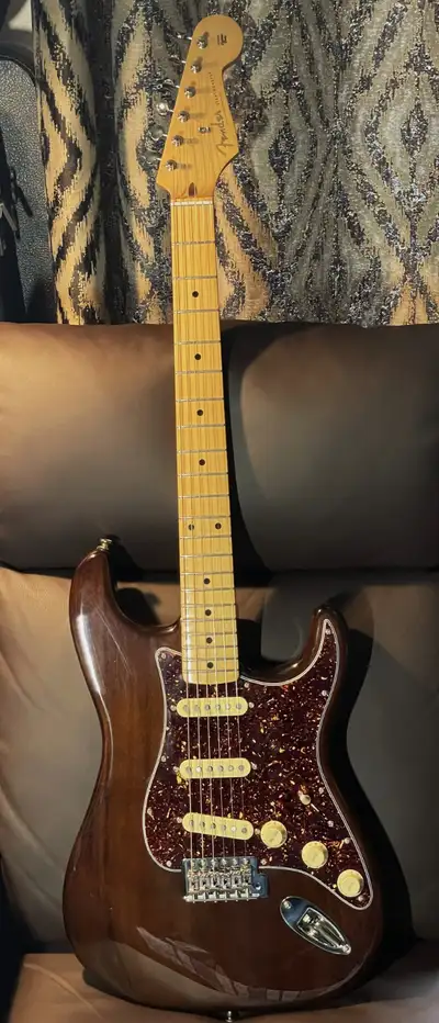 A new MIM Strat in gloss Walnut finish, Vintera Maple "Soft V" 7.25" radius, 21 fret neck with vinta...