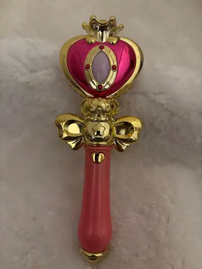 This is a used Sailor Moon wand that is in good condition. This toy wand would be great for any kid...