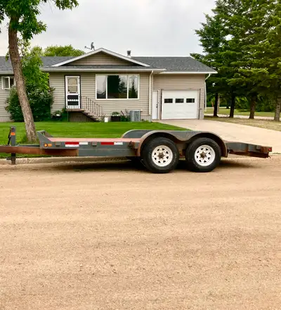 16ft trailer with tandem 3500lbs axels for sale. Has loading ramps with stabilizing legs, treated de...