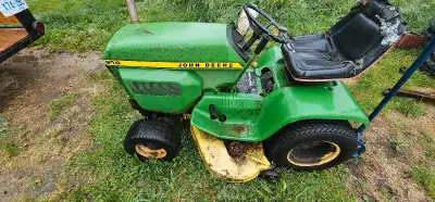 1980s john deere 214 garden tractor. Runs great but the transmission is stuck in gear. Has 46 inch d...