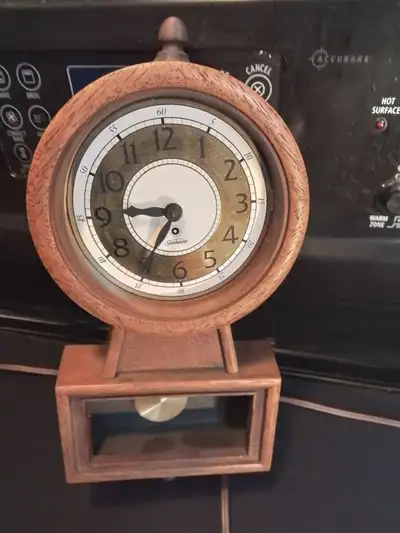 Vintage Sunbeam Electric Clock w Pendulum Wall clock with a pendulum. Clock face has a white backgro...