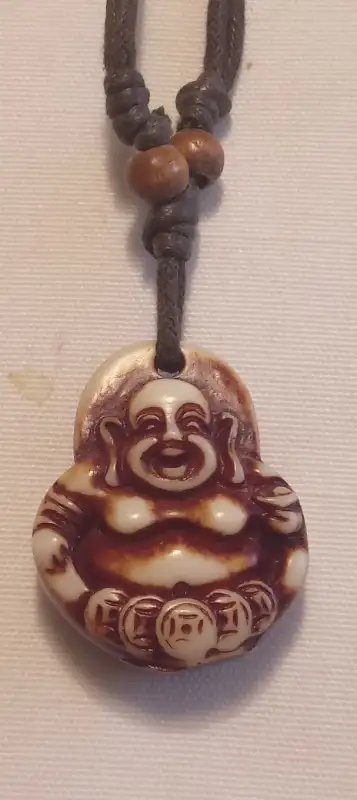 A FINELY CARVED BUDDA IN BONE NECKLACE IT IS IN PERFECT CONDITION IT CAN BE PICKED UP IN ALLISTON