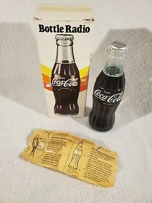 This collectible am radio in the shape of a bottle of coca cola is $31 Where Heads Meet 150 Ottawa S...