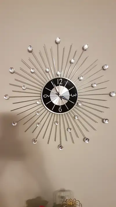 Large starburst wall clock. Add some bling to your decor with this lovely starburst wall clock. Simi...